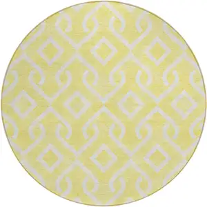 Photo of 8' Yellow And Ivory Round Geometric Washable Indoor Outdoor Area Rug