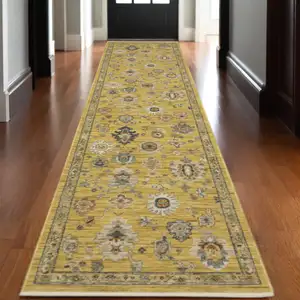 Photo of 12' Yellow Black And Ivory Oriental Runner Rug With Fringe