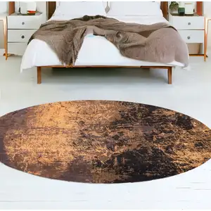 Photo of 8' Yellow and Brown Round Abstract Non Skid Area Rug