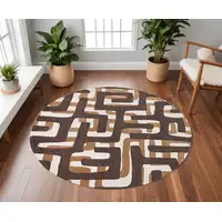 Photo of 8' Yellow and Brown Round Abstract Non Skid Area Rug