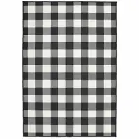 Photo of 7'x10' Black and Ivory Gingham Indoor Outdoor Area Rug