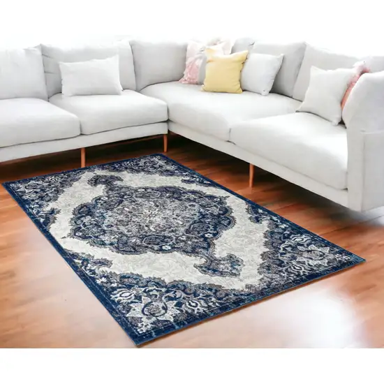 5' x 7' Blue and Gray Medallion Power Loom Area Rug Photo 1