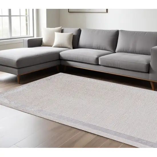 Ivory Silver Machine Woven Bordered Indoor Area Rug Photo 1