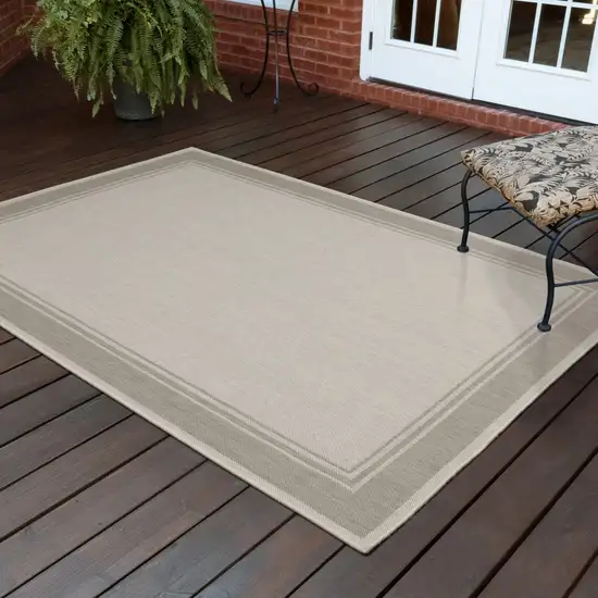 7'x9' Ivory and Gray Bordered Indoor Outdoor Area Rug Photo 9