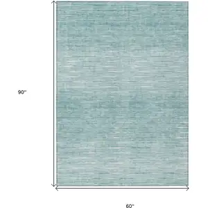 Photo of Aqua And Ivory Abstract Washable Indoor Outdoor Area Rug