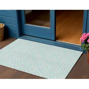 Photo of Aqua And Ivory Geometric Washable Indoor Outdoor Area Rug