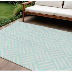 Photo of Aqua And Ivory Geometric Washable Indoor Outdoor Area Rug