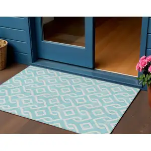 Photo of Aqua And Ivory Geometric Washable Indoor Outdoor Area Rug