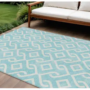 Photo of Aqua And Ivory Geometric Washable Indoor Outdoor Area Rug