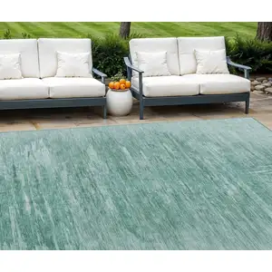 Photo of Aqua And Teal Blue Abstract Washable Indoor Outdoor Area Rug