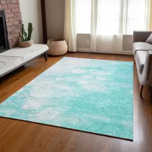 Photo of Aqua Ivory And Teal Blue Abstract Washable Indoor Outdoor Area Rug