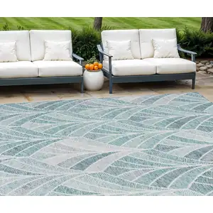 Photo of Aqua Mint Green And Silver Geometric Washable Indoor Outdoor Area Rug