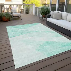 Photo of Aqua Sky Blue And Ivory Abstract Washable Indoor Outdoor Area Rug