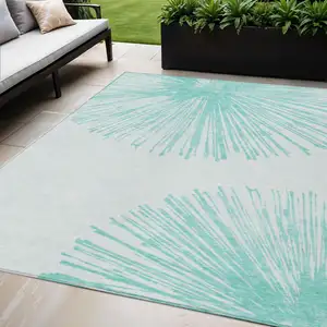 Photo of Aquamarine And Ivory Abstract Washable Indoor Outdoor Area Rug