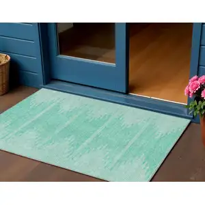 Photo of Aquamarine And Ivory Abstract Washable Indoor Outdoor Area Rug