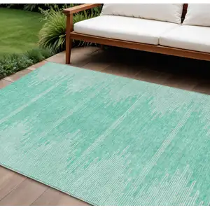 Photo of Aquamarine And Ivory Abstract Washable Indoor Outdoor Area Rug