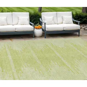 Photo of Artichoke Green And Ivory Abstract Washable Indoor Outdoor Area Rug