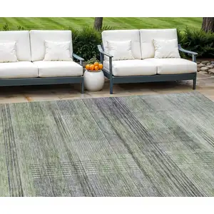 Photo of Artichoke Green Purple And Fern Green Striped Washable Indoor Outdoor Area Rug