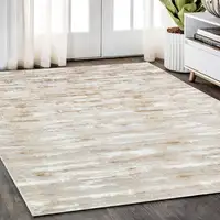 Photo of Beige Abstract Washable Non Skid Area Rug With Fringe