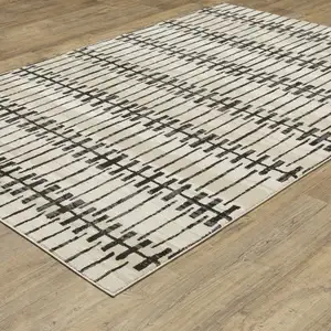 Photo of Beige And Black Geometric Area Rug