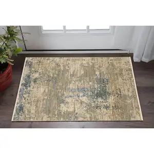 Photo of Beige And Blue Abstract Area Rug With Fringe