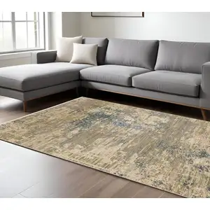 Photo of Beige And Blue Abstract Area Rug With Fringe