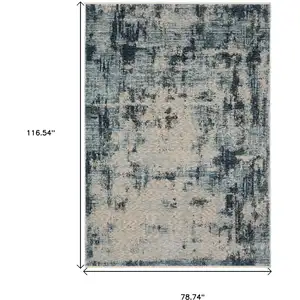 Photo of Beige And Blue Abstract Distressed Area Rug With Fringe