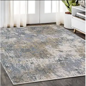 Photo of Beige And Blue Abstract Distressed Area Rug With Fringe