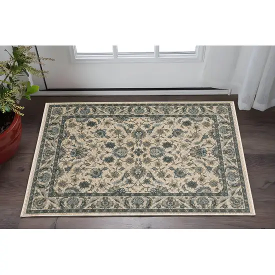 Beige And Blue Oriental Area Rug With Fringe Photo 1