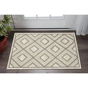 Photo of Beige And Brown Geometric Area Rug