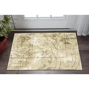 Photo of Beige And Brown Geometric Area Rug