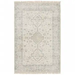 Photo of Beige And Charcoal Oriental Hand Loomed Stain Resistant Area Rug With Fringe