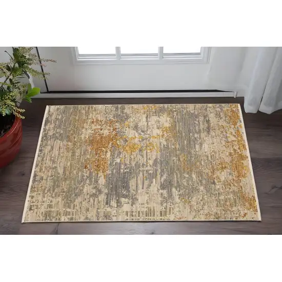 Beige And Gold Abstract Area Rug With Fringe Photo 1