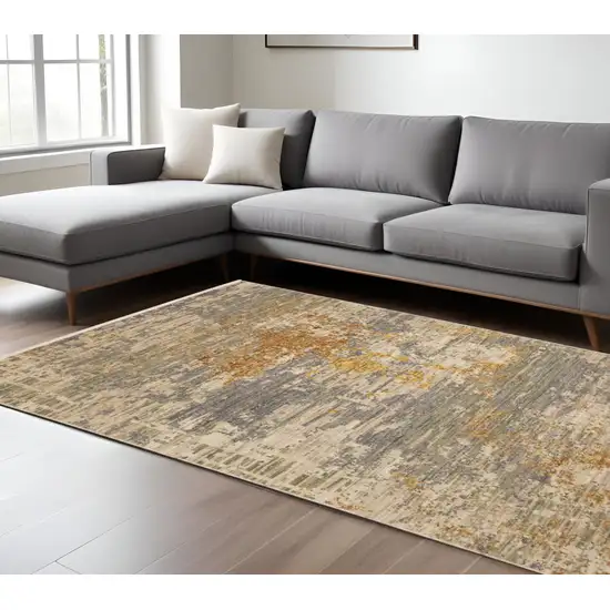 Beige And Gold Abstract Area Rug With Fringe Photo 1