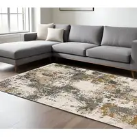 Photo of Beige And Gray Abstract Distressed Area Rug With Fringe