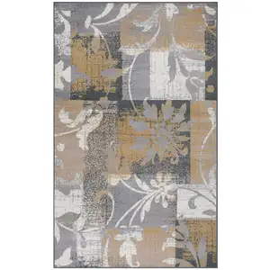 Photo of Beige And Gray Floral Power Loom Distressed Stain Resistant Area Rug