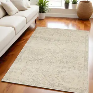 Photo of Beige And Gray Geometric Distressed Area Rug