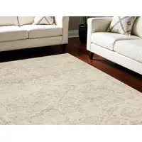 Photo of Beige And Gray Geometric Distressed Area Rug