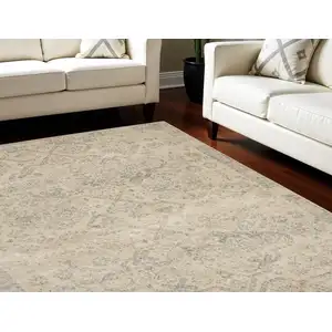 Photo of Beige And Gray Geometric Distressed Area Rug