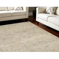 Photo of Beige And Gray Geometric Distressed Area Rug