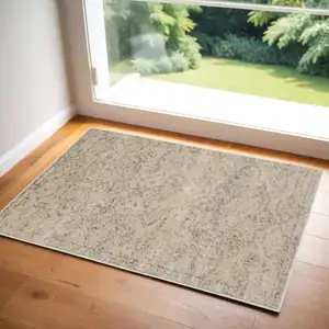 Photo of Beige And Gray Oriental Distressed Area Rug