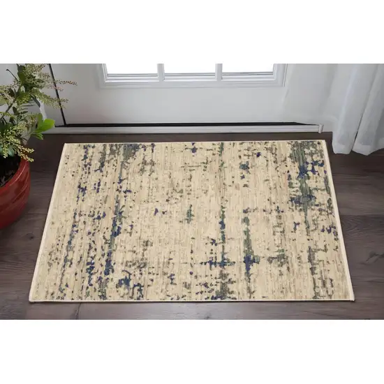 Beige And Green Abstract Area Rug With Fringe Photo 1