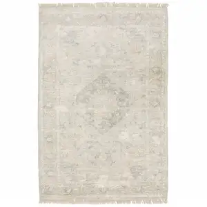 Photo of Beige And Grey Oriental Hand Loomed Stain Resistant Area Rug With Fringe