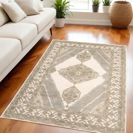 Beige and Ivory Oriental Power Loom Area Rug Photo 1