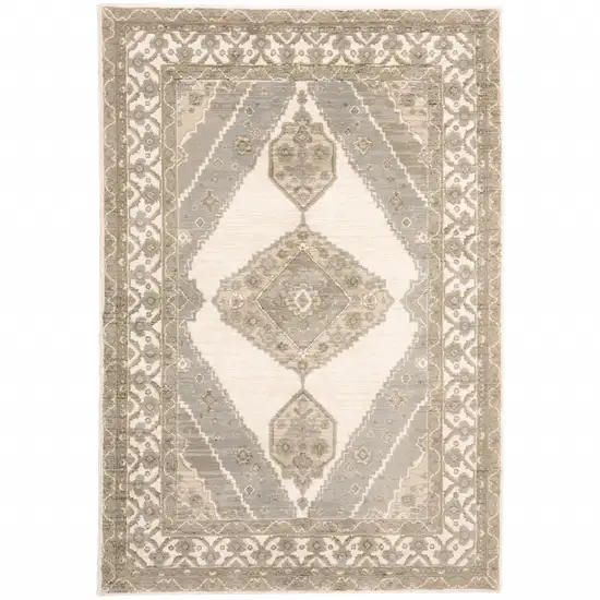 Beige And Ivory Oriental Power Loom Stain Resistant Area Rug Photo 1