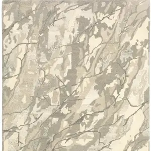 Photo of Beige And Ivory Wool Abstract Hand Tufted Area Rug