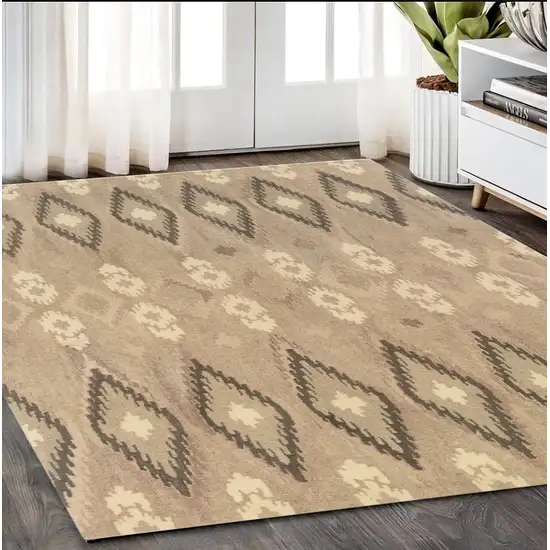 Beige And Ivory Wool Abstract Hand Tufted Area Rug Photo 1