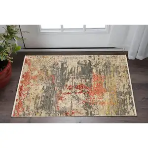 Photo of Beige And Pink Abstract Area Rug With Fringe