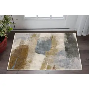 Photo of Beige And Rust Abstract Area Rug With Fringe