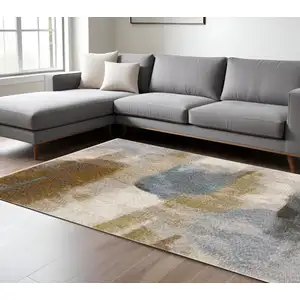 Photo of Beige And Rust Abstract Distressed Area Rug With Fringe